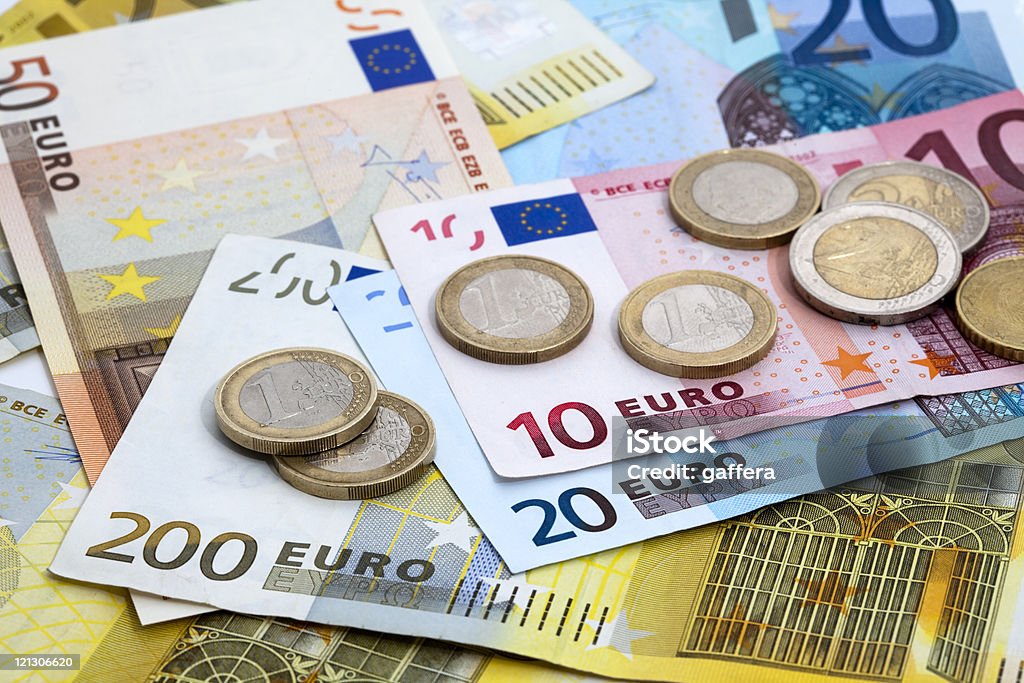 Variety of denominations of Euro coins and bills euro bills and coins European Union Currency Stock Photo