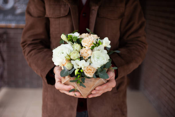 istock Elegance Flowers Composition in Man's Hands. 1213066622