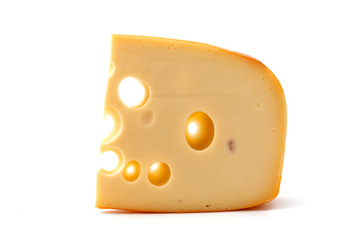 close-up of a piece of cheese with holes