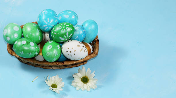 istock Decorated golden eggs on a trendy blue background. Minimal holiday concept. Happy Easter background, place for text, postcard, banner for the screen. 1213078156