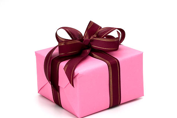 istock Pink gift box secured with red and golden bow. 121308382