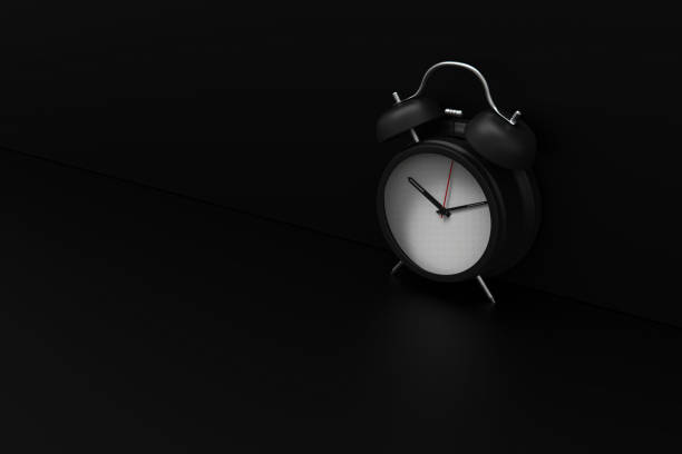 istock 3d rendering alarm clock on black background stock photo 1213085275