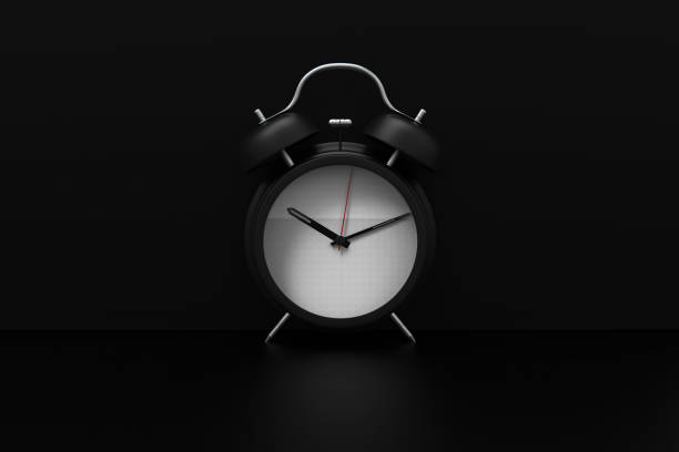 istock 3d rendering alarm clock on black background stock photo 1213085280