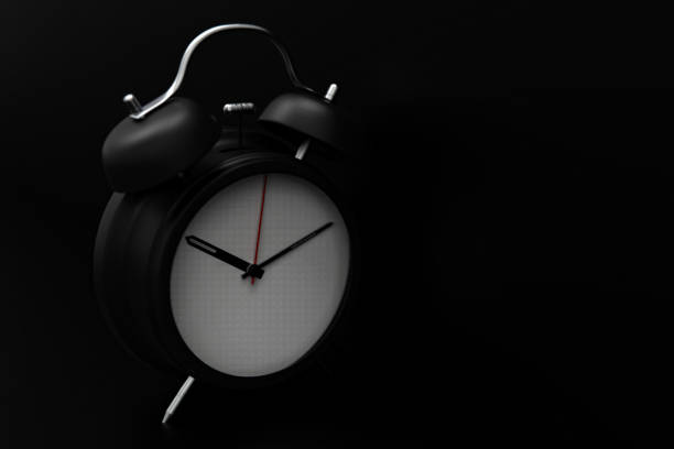 istock 3d rendering alarm clock on black background stock photo 1213085282