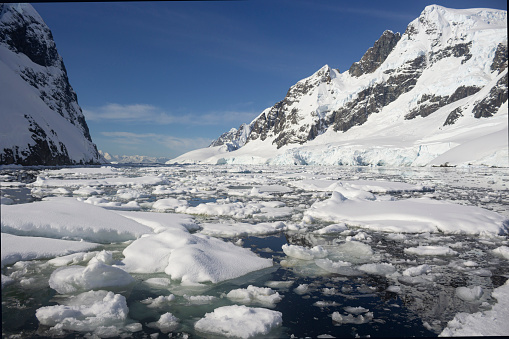 Image of the breaking ice over the waters at the James Ross Island, a large island off the southeast side and near the northeastern extremity of the Antarctic Peninsula in Antarctica