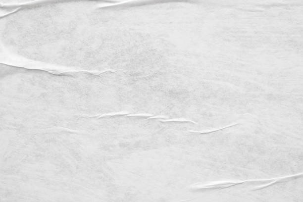 istock Blank white crumpled and creased paper poster texture background 1213087152