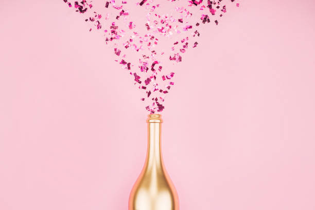 istock Bottle of champagne and confetti. 1213087200