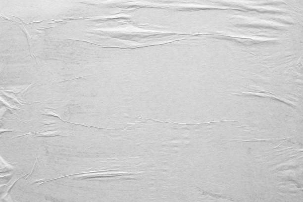 istock Blank white crumpled and creased paper poster texture background 1213087329