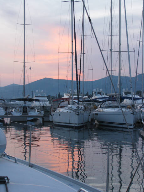 istock Yachts without sails in the marina at sunset. 1213087438