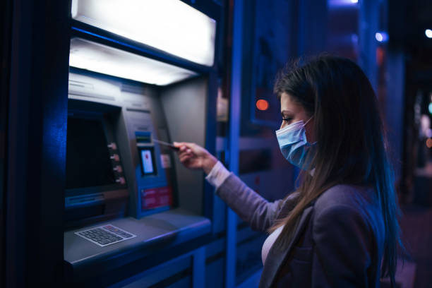 Woman Taking Money From ATM