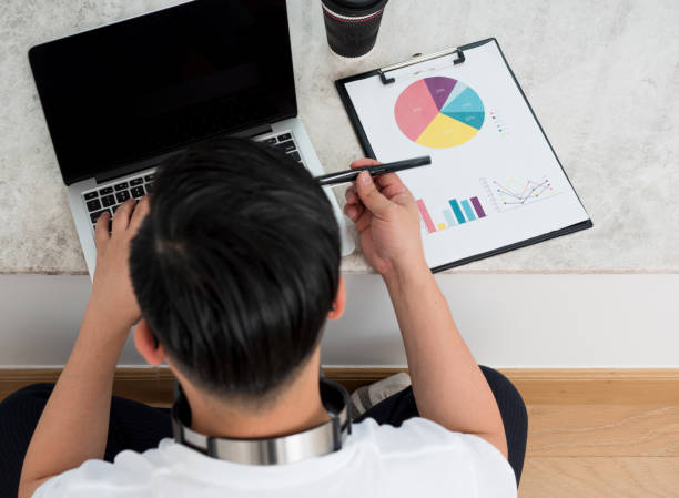 istock Asian business men use computers to work on windowsills 1213090357
