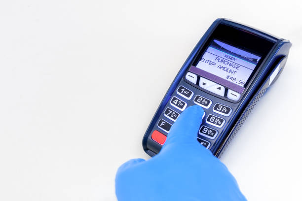 istock Gloved Hand Using Retain Credit Card Terminal 1213091568
