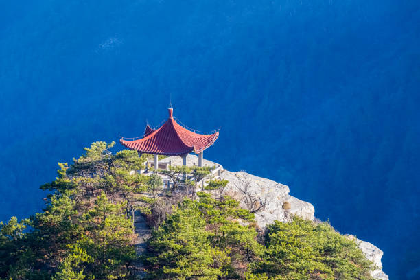 traditional pavilion in mount lu,   watching cloud pavilion closeup on blue forest background