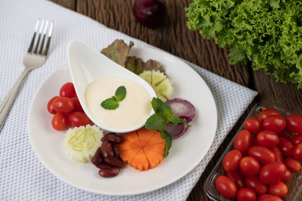 istock Ingredients for making salad and salad dressing in cups. Selective focus 1213103478