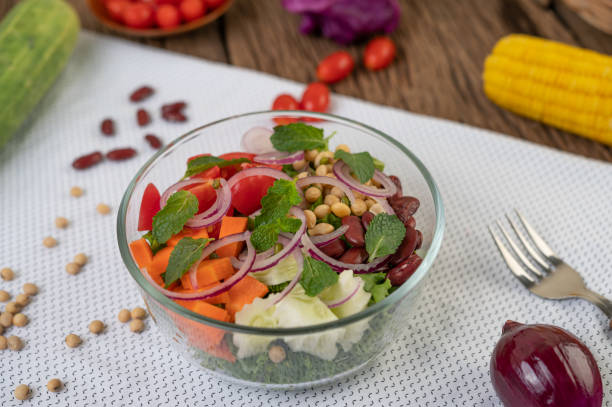 istock Fruit and vegetable salad in a glass cup on a white ground. Selective foucs 1213103605