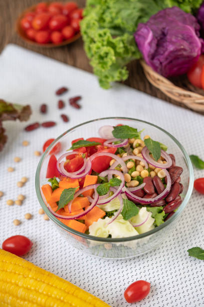 istock Fruit and vegetable salad in a glass cup on a white ground. Selective foucs 1213103673