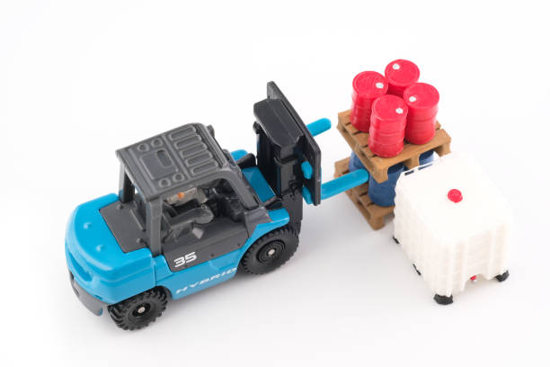 istock Engineer drive forklift and lift up drums in pallet 1213119575