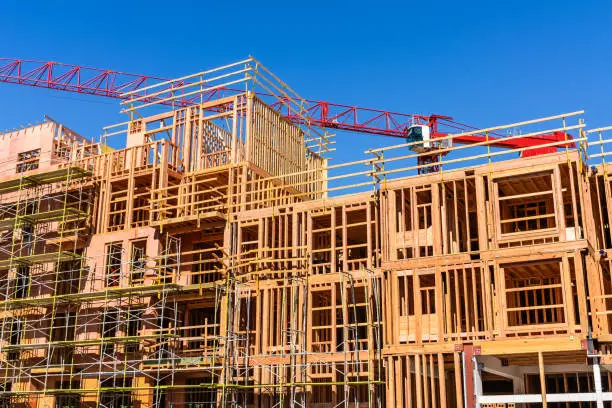 Photo of Exterior view of multifamily residential building under construction in Palo Alto; the entire Silicon Valley and San Francisco Bay Area is facing a housing crisis, with increased housing costs