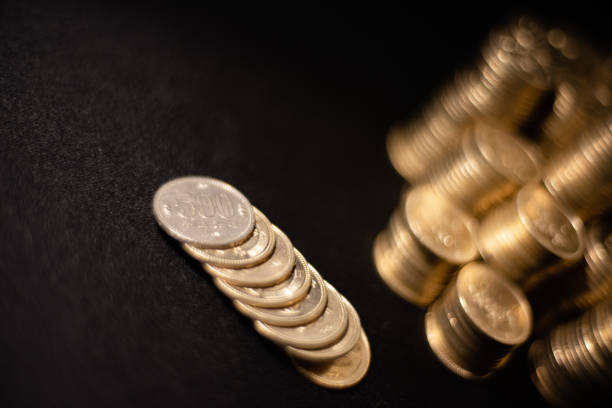 istock Enormous 500JPY coins glitter in darkness 1213120853