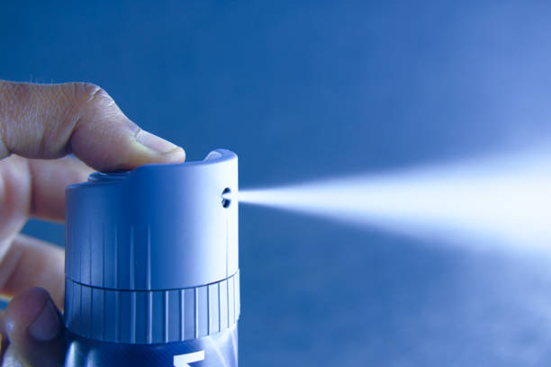 istock Close up of man hand applying perfume with copy space 1213121097