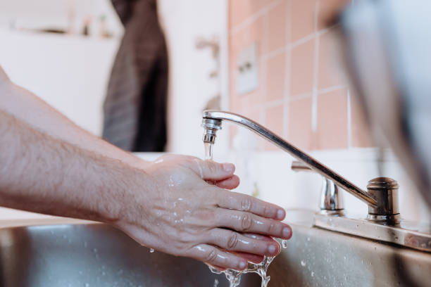 istock Person washing hands to prevent contagious disease 1213121514