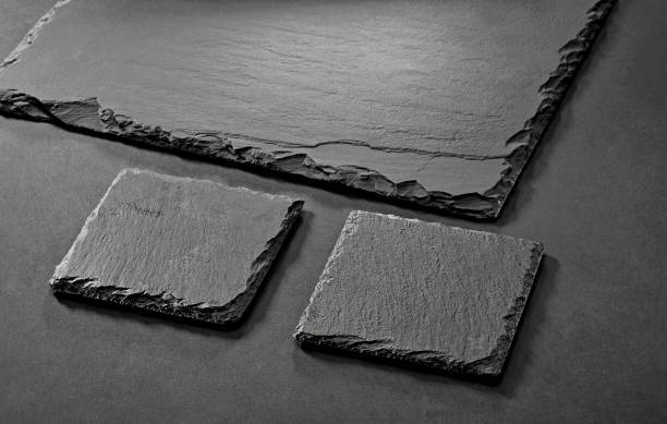black  natural stone coasters on gray background