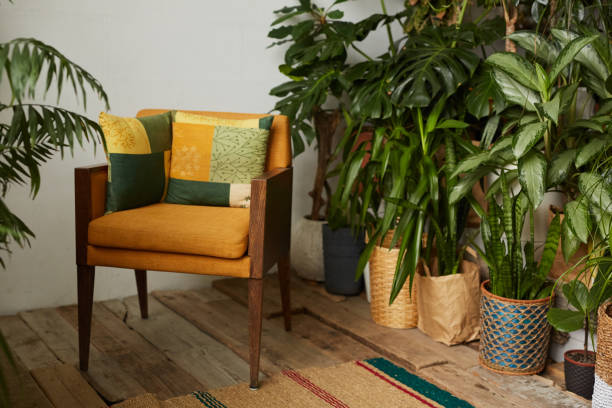 istock Fashionable armchair with plants 1213128257