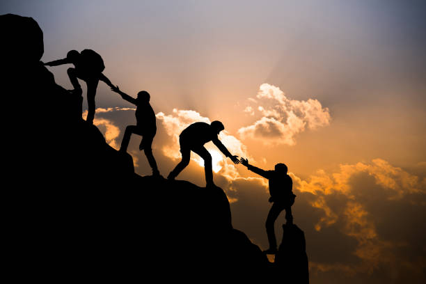 Group of people on peak mountain climbing helping team work , travel trekking success business concept Group of people on peak mountain climbing helping team work , travel trekking success business concept group of people people recreational pursuit climbing stock pictures, royalty-free photos & images