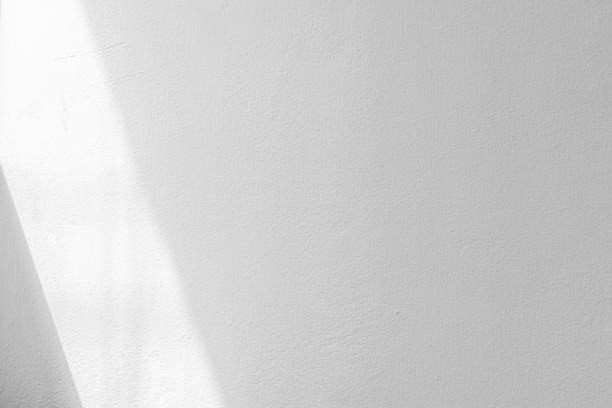 istock Abstract white cement concrete material wall texture background with lighting sunshine from window 1213131762