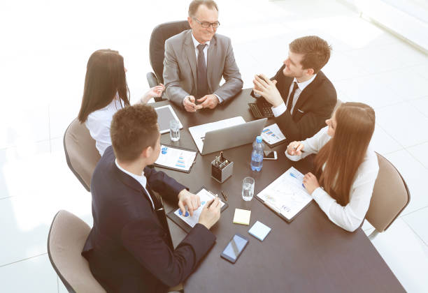 istock from the top view.business team discussing a problem with a business. 1213132554
