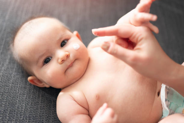 istock Mother makes massage with baby 1213133795