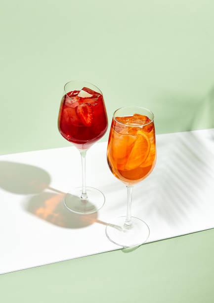 istock Red and orange summer cocktail on creative background 1213138629