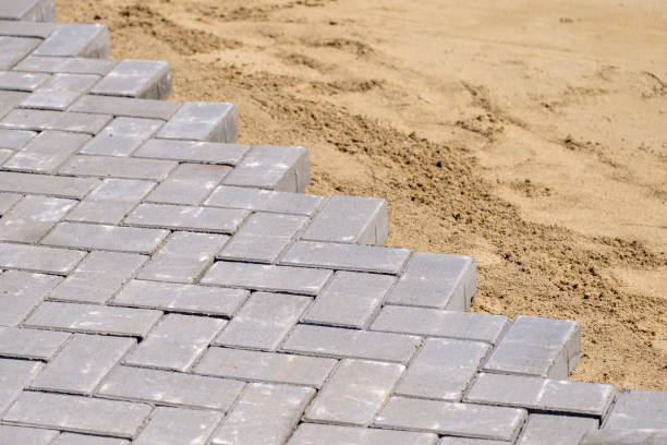 istock a diagonal of tiles and uncovered ground with sand on it 1213139700