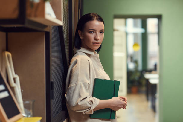 istock Businesswoman with notepad at office 1213139880