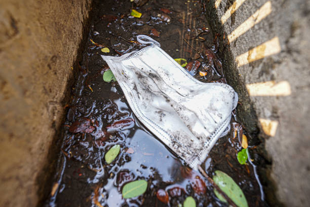 istock Allergy face mask were left in the digusting drain 1213140150