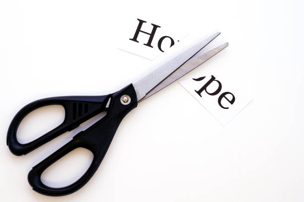 istock the sheet with the inscription hope is cut with scissors on a white background 1213140494