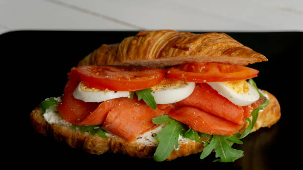 istock Fresh smoked salmon Croissant sandwich. Snack, lunch, breakfast 1213141351