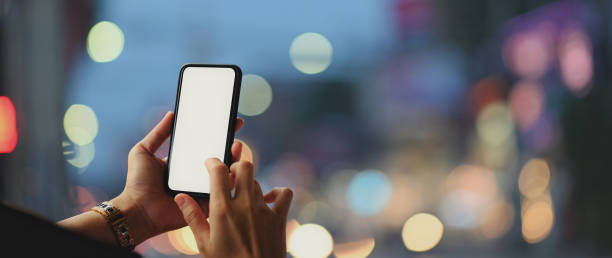 Close up view of a woman using blank screen smartphone