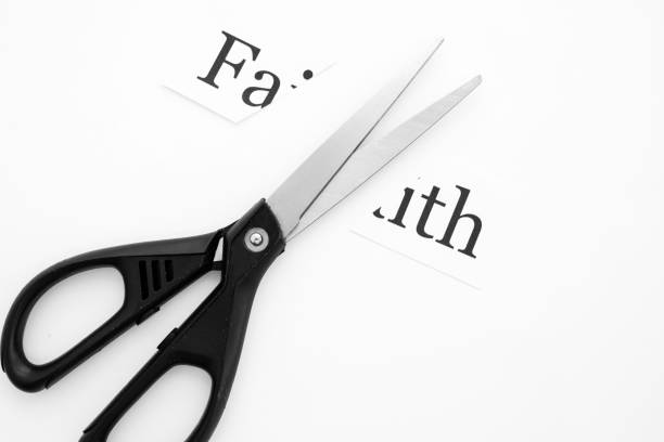 istock black stationery scissors cut faith written 1213143846