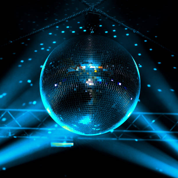istock Closeup blue light disco ball with dots on wall, night club background. 1213145404