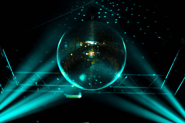 istock Blue light disco ball with rays and dots on wall, night club background. 1213145455
