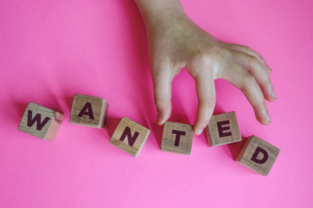 istock WANTED word made with building blocks. 1213145626