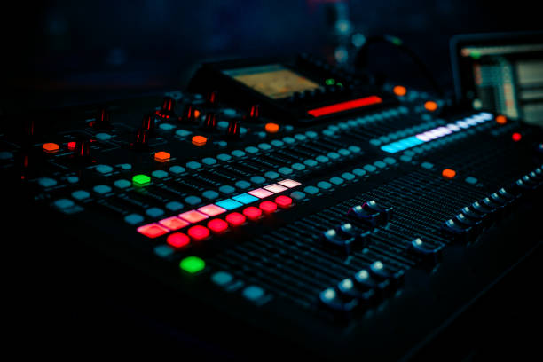 istock Closeup pro audio digital mixing console in dark club with spotlights 1213146728