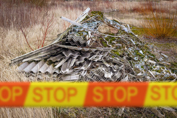 Asbestos roof removal . Asbestos dust in the environment. Stop health problems stock photo