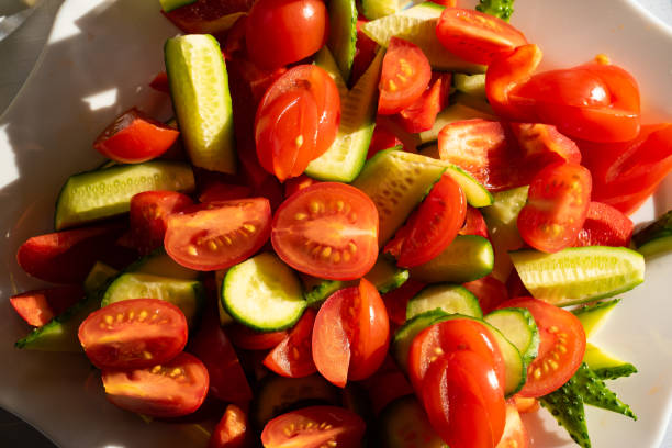 istock a salad of sliced tomatoes and cucumbers. 1213146949