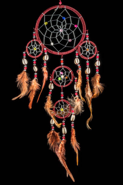 istock Pearl-embroidered dream catcher with colorful feathers and pearls 1213147921
