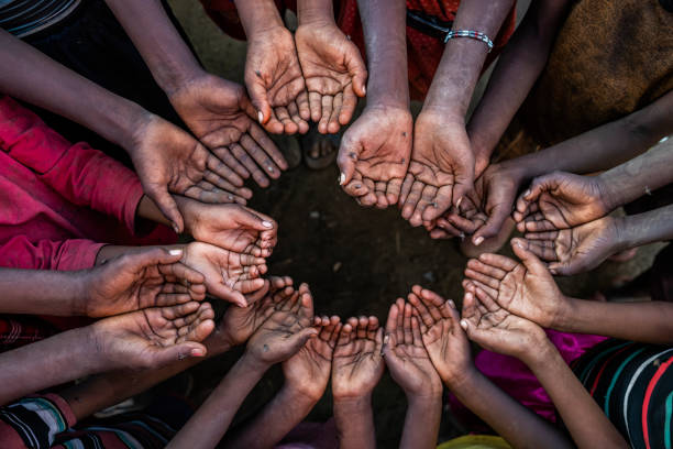 istock Hands of poor - asking for help, Africa 1213148333