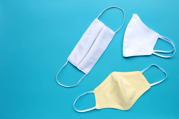 istock Handmade cloth masks on blue  background. 1213150272