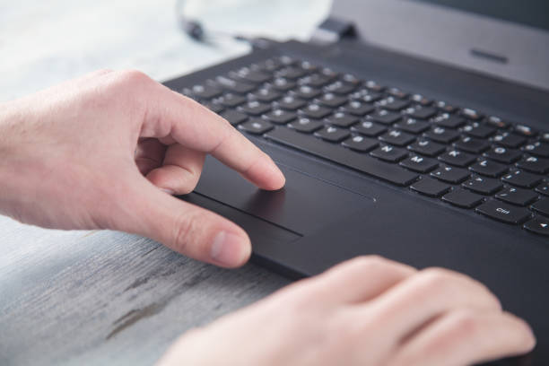 istock Male hand touching with laptop touchpad. 1213150389