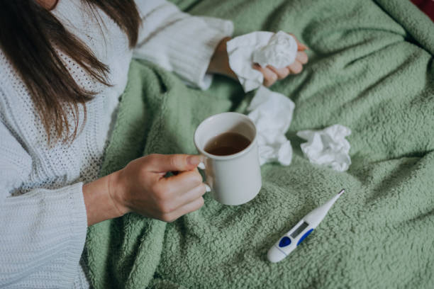 istock Woman sick in bed, covered with blanket 1213152426